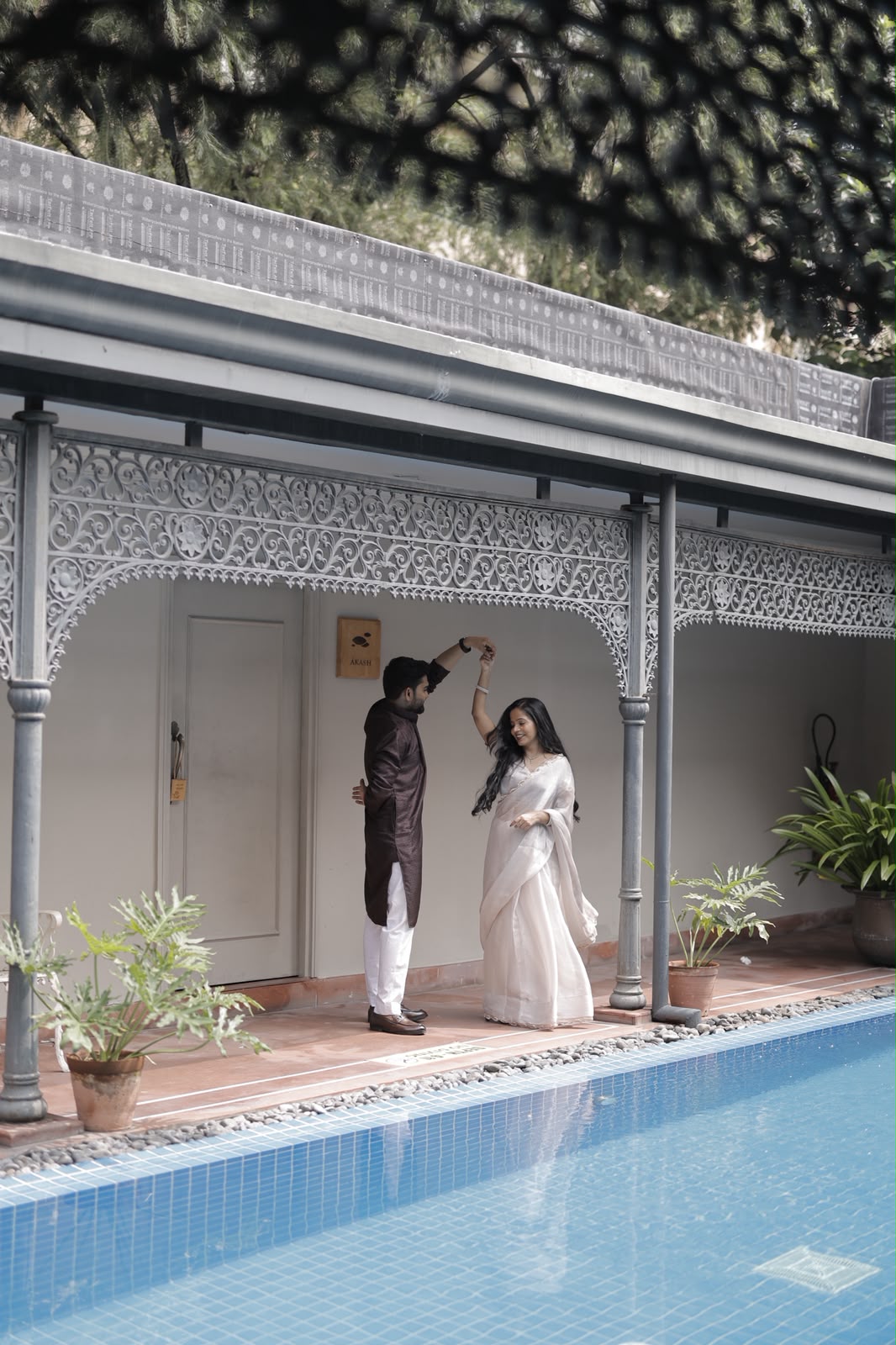 Nishit and Nidhi dancing by the pool